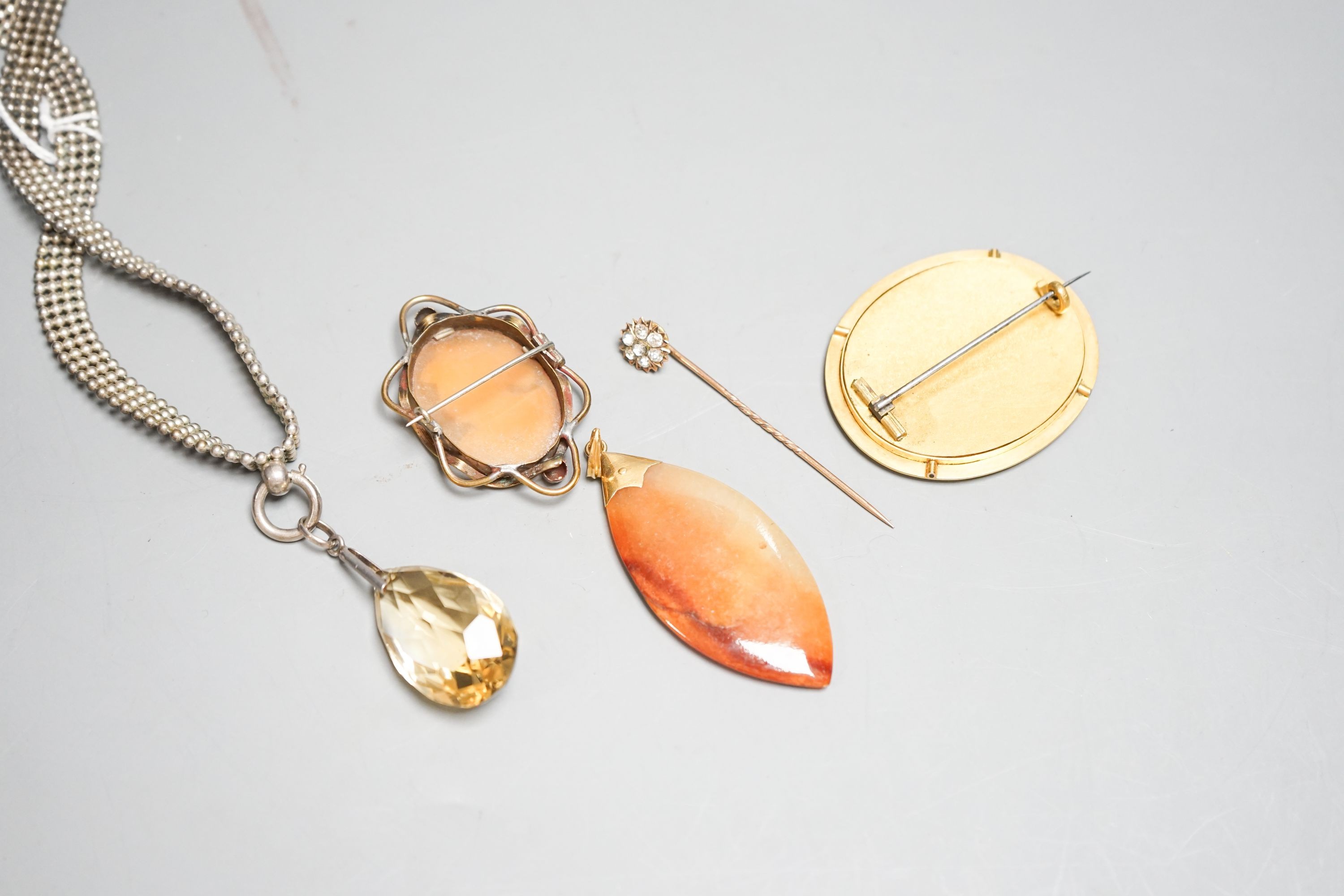 Mixed jewellery including cameo brooch, agate pendant, oval brooch, paste set stick pin and pendant on white metal chain.